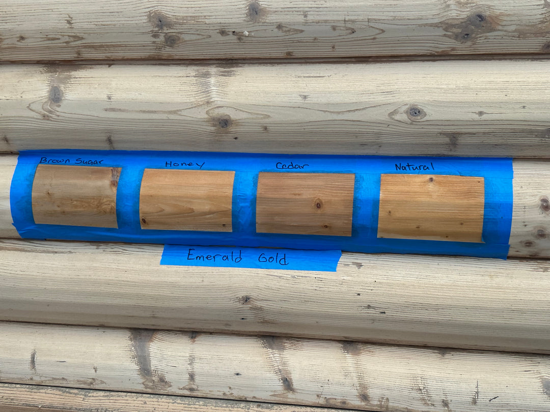 Log siding with 4 color samples on the logs.
